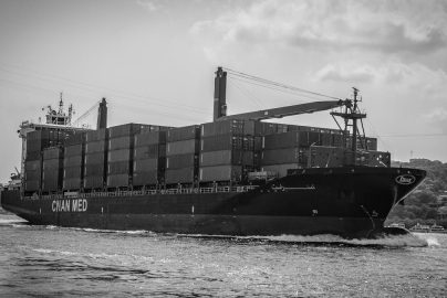 Black and white photo of a container ship in Istanbul, Turkey.